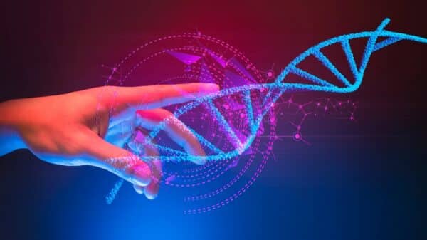 Ruka koja dodiruje model DNA molekule – prikaz što je DNA u interaktivnom formatu.