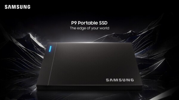 Samsung P9 Portable SSD, a dark gray rectangular external drive with a blue LED indicator strip, on a reflective black surface against a background of jagged dark crystal formations.