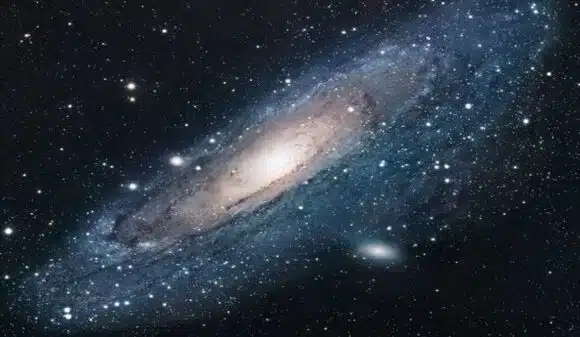 (tekst ispod slike) Patuljaste galaksije stvorile su krug i kreću se oko galaksije Andromeda u naizgled složenoj koreografiji. Ovo je prvi put da astronomi gledaju jednu takvu neobičnu strukturu; shvaćanje tog procesa moglo bi pomoći našem razumijevanju nastanka galaksija. Slika: ESA/Wikicommons