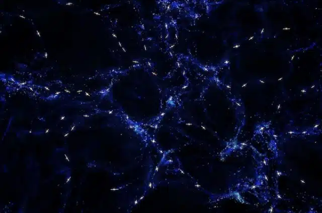 Misteriozna povezanost osi vrtnje kvazara (bijelo) i struktura ogromnih razmjera (plavo) u kojim se nalaze. (Image credits: ESO/M. Kornmess)