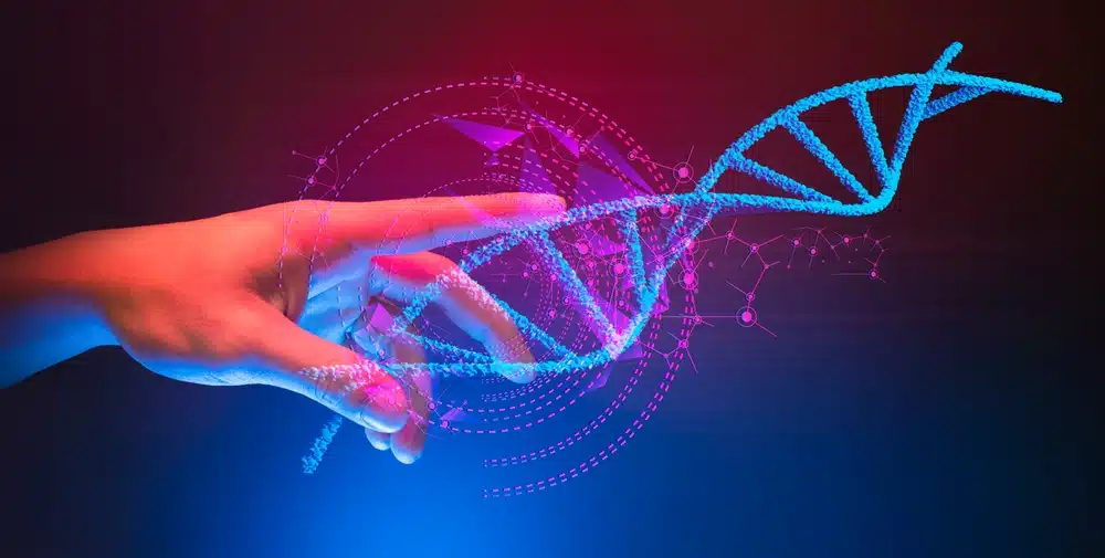 Ruka koja dodiruje model DNA molekule – prikaz što je DNA u interaktivnom formatu.